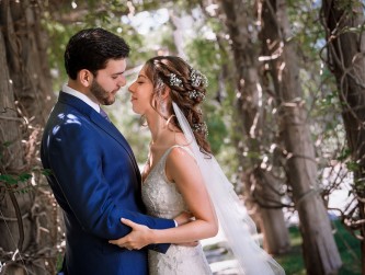 Loving couple under the wisteria vines, Lisa Nicolosi photography